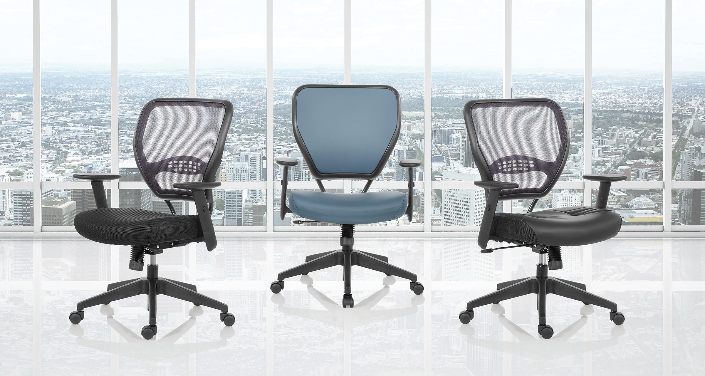 Three office chairs in front of a large window with a cityscape view.